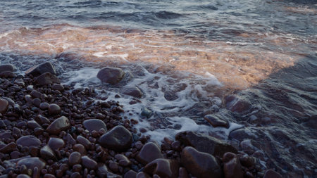 Slow motion closeup shot of clear sea water on Saint Raphael beachの写真素材
