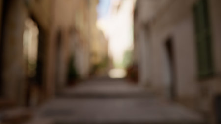 Blurred background of Villefranche-Sur-Mer narrow street on a sunny dayの写真素材