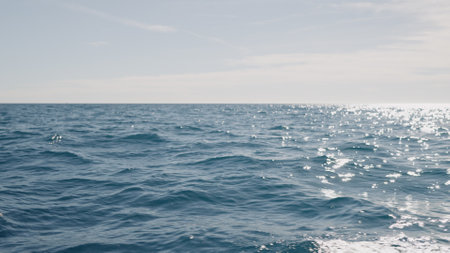 Slow motion side view of sea surface from a boatの写真素材