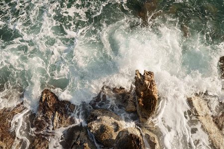 Fresnch Riviera cliffs with sea waves crushing on them