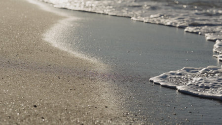 shot of evening waves on Cannes beach before sunsetの写真素材