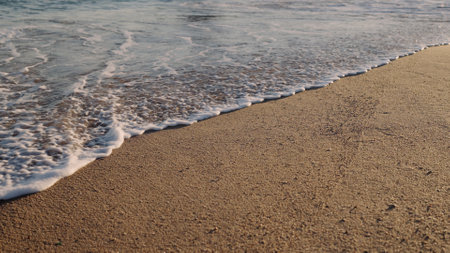shot of evening waves on Cannes beach before sunset