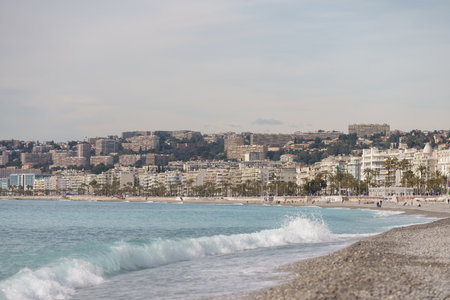 Nice, France - March 8 2021: Nice beach with people chilling during warm spring dayのeditorial素材