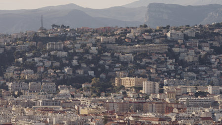 Nice, France - March 16, 2023: Panoramic view of Nice City with mountains on backgroundのeditorial素材