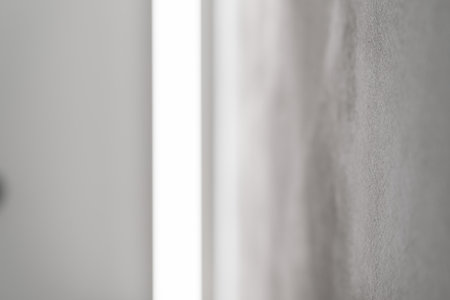 Abstract photo of white wall with light reflection from a light bar
