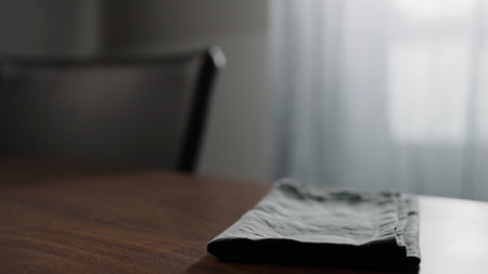 linen napkin on wood table with copy spaceの写真素材