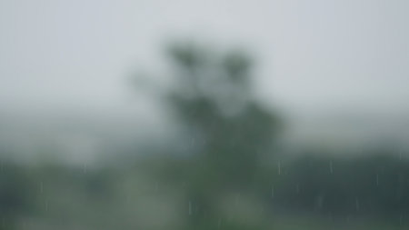 Defocused background of rain over rural landscapeの写真素材