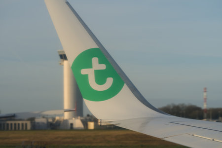 Nantes, France - 20 March 2023:: Transavia green logo on Boeing 737 planeのeditorial素材