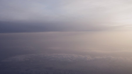Airplane shot, flying in haze clouds over europe