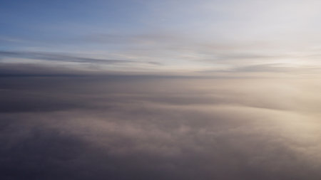 Airplane shot, flying in haze clouds over europe