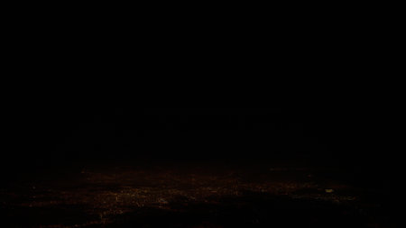 Airplane shot, flying over night cityの写真素材