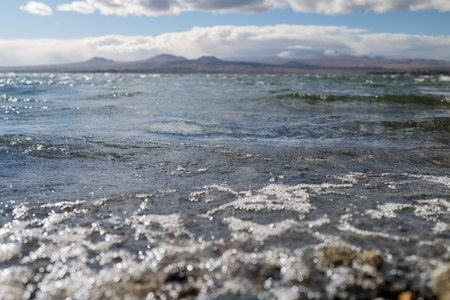 Sevan lake lanscape with mountains on background on a warm autumn dayの写真素材