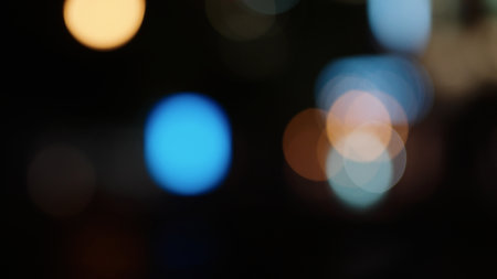 Bokeh background of night city with car light passing byの写真素材