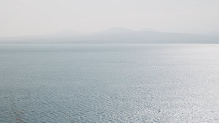 Sevan lake in October on a hazy dayの写真素材