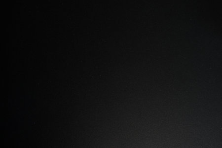 Dark Black painted metal surface closeup backgroundの写真素材