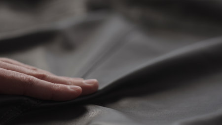 Closeup man touching fine leatherの写真素材