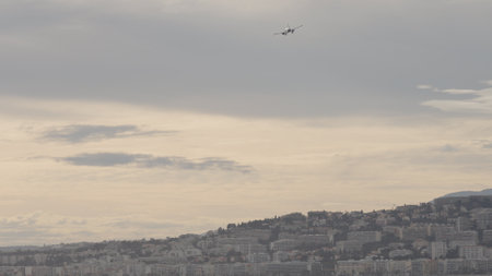 NICE, FRANCE - MARCH 8, 2023: panoramic shot of plane landing in Cote D Azur airportのeditorial素材