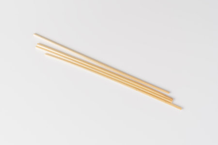 biodegradable drinking straw made from dried grass on white