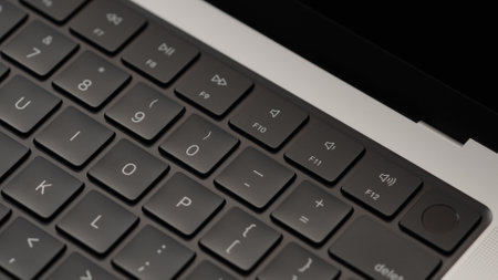 Saint-Petersburg, Russia - Circa December, 2022: Closeup of keyboard on open apple macbook pro 14...