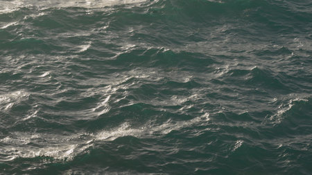 blue water sea surface with soft summer light closeupの写真素材