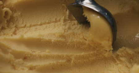 close up scooping orange sorbetの写真素材