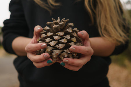 teen girl holding big coneの写真素材
