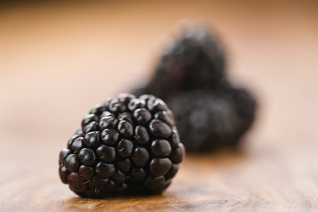 Closeup ripe blackberries on wood backgroundの写真素材