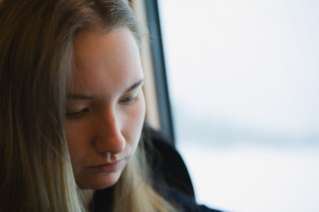 portrait of teen girl traveling by trainの写真素材