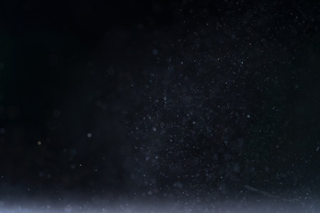 backlit real dust particles with lens flareの写真素材