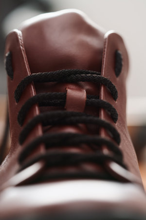 Closeup detail shot of brown leather sneaker