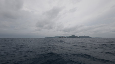 Front view from boat in Indian ocean sailing between Seychelles islands before stormの写真素材