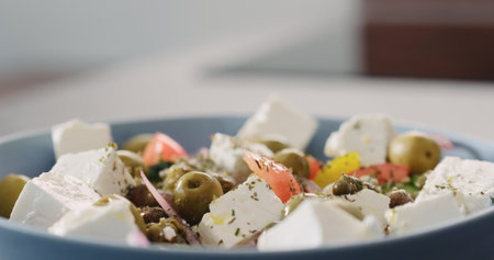 Closeup greek salad in blue bowlの写真素材