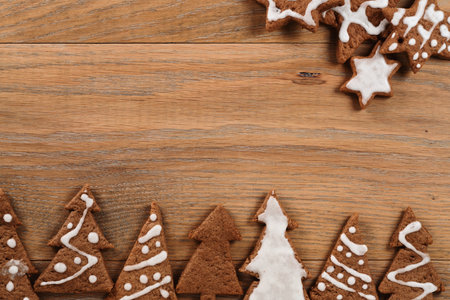 Gingerbread chrismas cookies on oak wood background with copy space