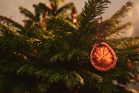 Closeup small christmas tree with natural decorations indoor