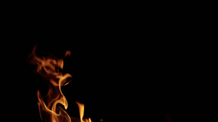 fire flames of campfire over black background, for overlayの写真素材