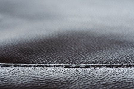 Closeup full grain gray brown leather clothes backgroundの写真素材