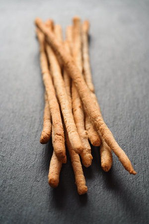 Traditional italian snack - grissini on concrete surface