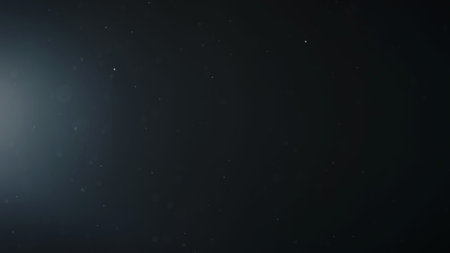 background of floating particles in air over black background and lens flare