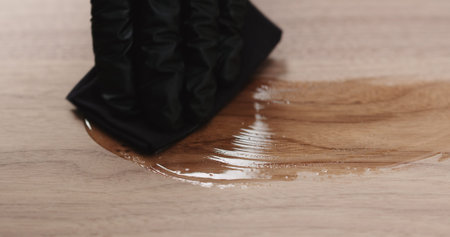 woodworker applying oil finish to black walnut board