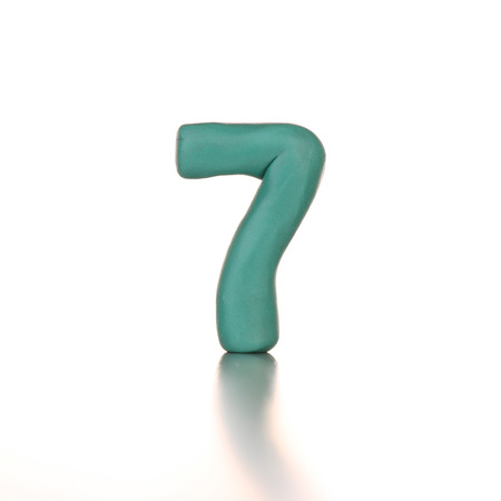 number seven made from plasticine isolated green