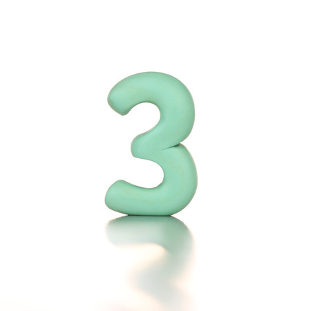 number three 3 made from plasticine isolated greenの写真素材