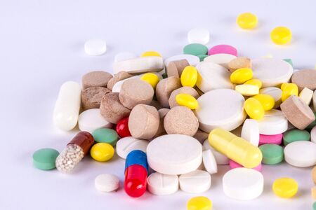 pile of tablets and pills and capsuleの写真素材