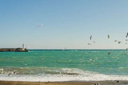Sea embankment and lighthouse in Yalta. Yalta is a popular Crimean resort. Crimea. Ukraine. Russia.の写真素材