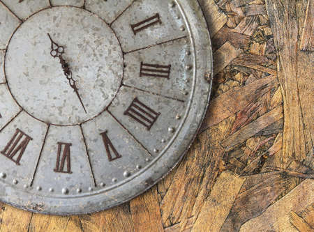Wall clock old rusty grunge on wooden wall backgroundの写真素材