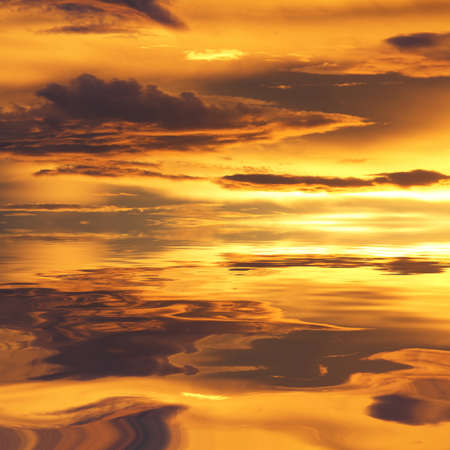Natural background of the gold color sky and beautiful water reflection, During the time sunrise and sunsetの写真素材