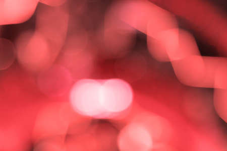 Abstract bokeh background image caused by shooting out of focus of light at nightの写真素材
