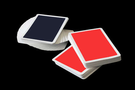 Stacks of playing cards isolated on black background