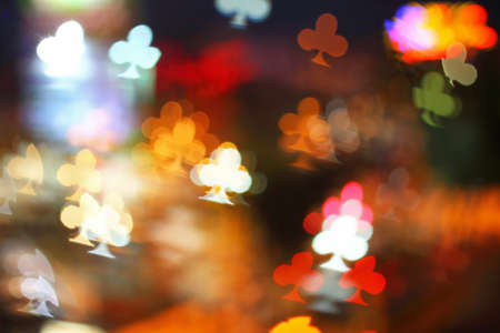 Multicolour bokeh clubs of playing card shape ,the art from night lights