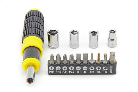 Screwdriver and wrench with different sizes for ease of use. Used with a yellow and black handle....