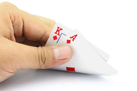 Closeup photos that focuses on the black jack with King card and ace card of diamond in the hand on...